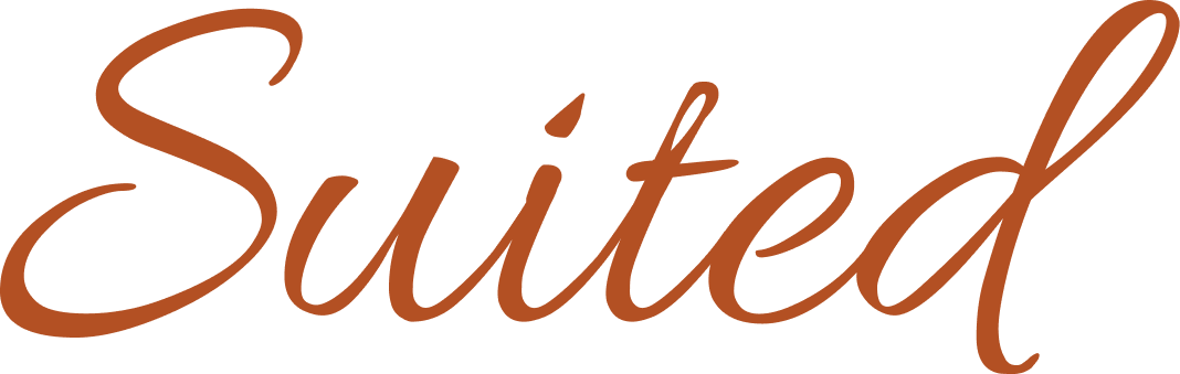 Professional woman wearing a cream blazer with navy trim